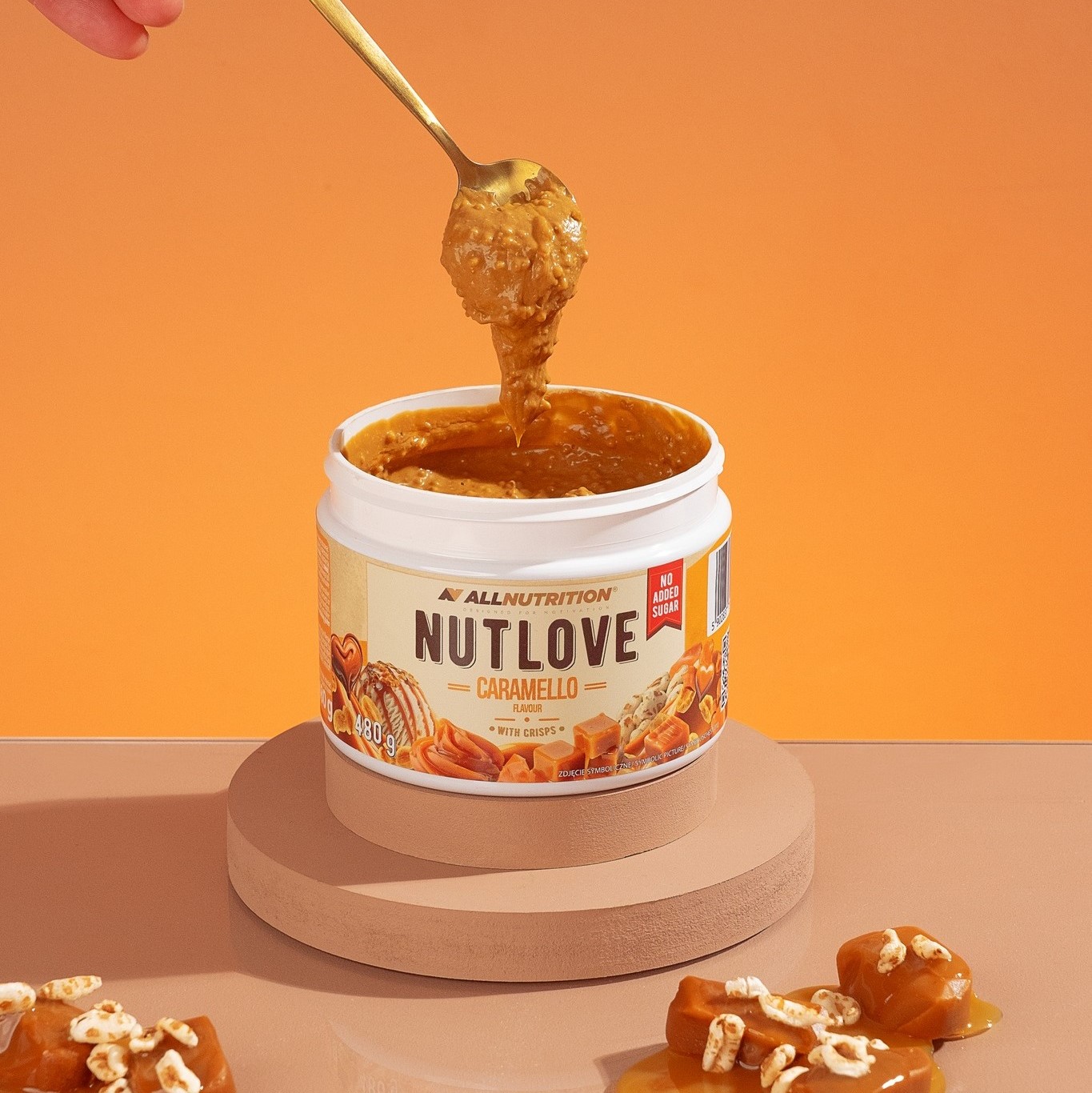 Open jar of Allnutrition NUTLOVE Caramello With Crisps, showing creamy caramel spread with visible rice crisps