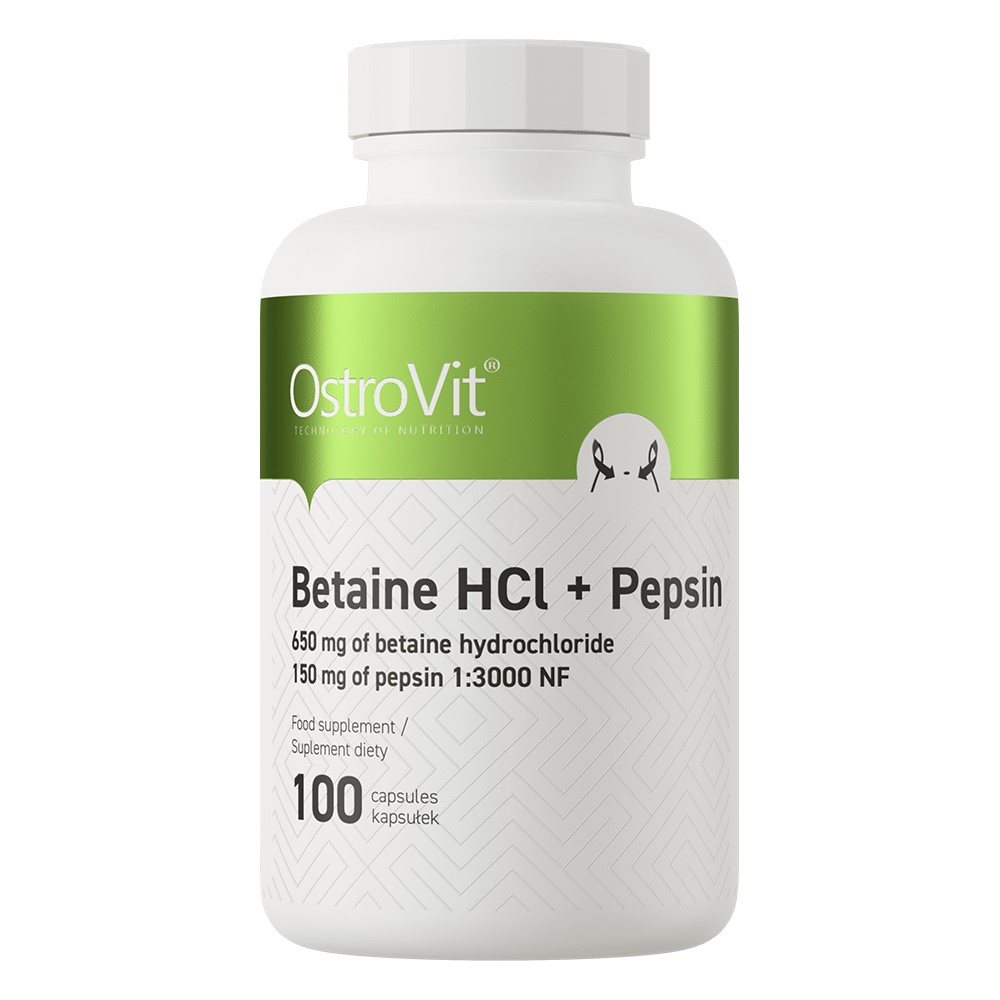 Close-up of OstroVit Betaine HCl + Pepsin capsules, clear vegetarian capsules filled with white powder