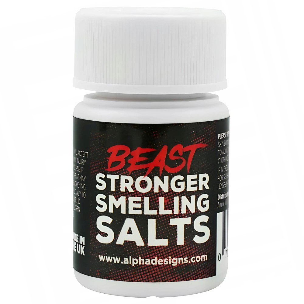 Alpha Designs Beast Stronger Smelling Salts, a powerful ammonia inhalant for athletes, in a small white bottle with a black and red label.