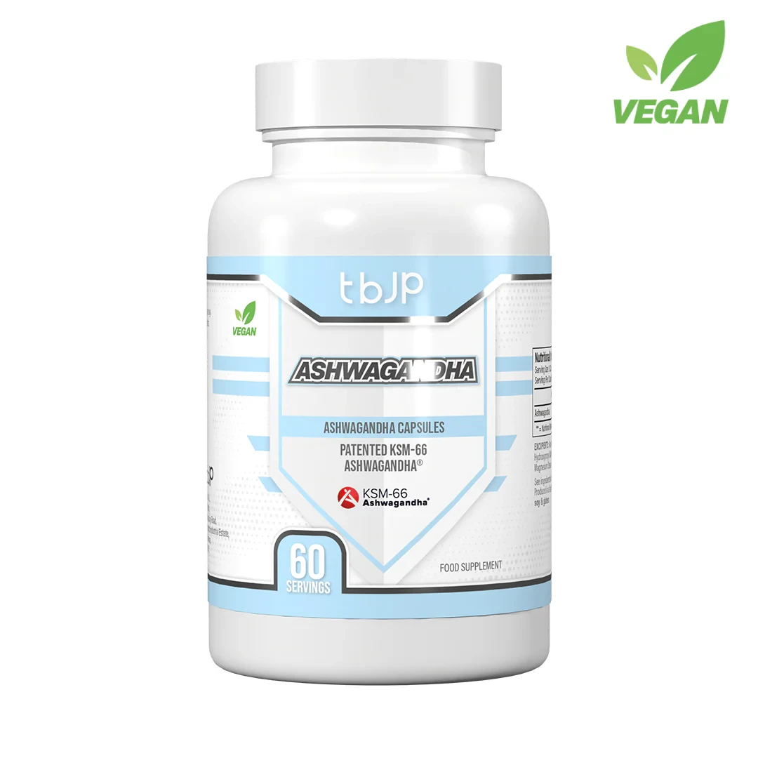 Trained by JP Ashwagandha 60 Caps vegan dietary supplement with KSM-66 ashwagandha extract, 60 servings per bottle, in a white and blue container.