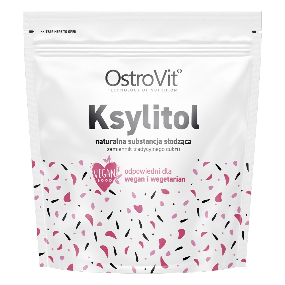 OstroVit Ksylitol 1000g natural sweetener, vegan-friendly, suitable for vegans and vegetarians, white pouch with pink and black confetti design.