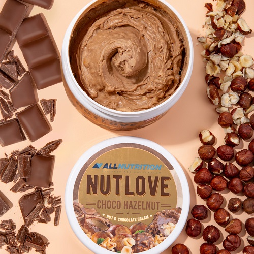 Allnutrition Nutlove Choco Hazelnut nut and chocolate cream spread, 500g, shown with chocolate pieces and hazelnuts, creamy texture, brown color.