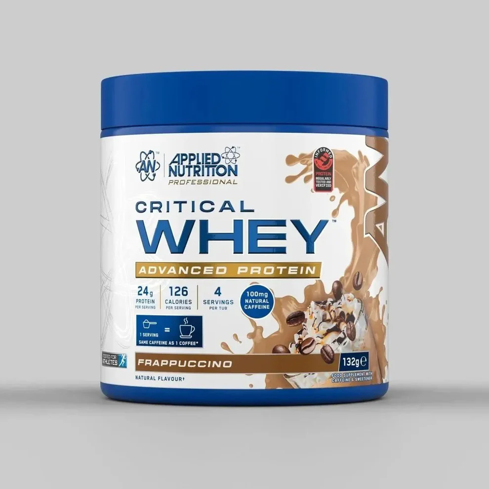 Applied Nutrition Critical Whey powder in a scoop, fine light-colored protein powder texture