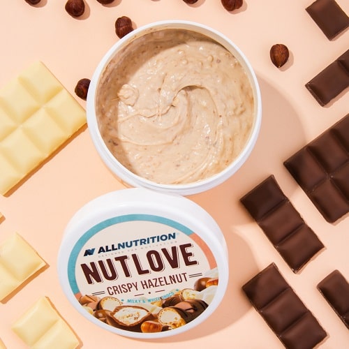 Allnutrition Nutlove Crispy Hazelnut 500g hazelnut spread with crispy texture, shown with chocolate and hazelnuts on a light background.