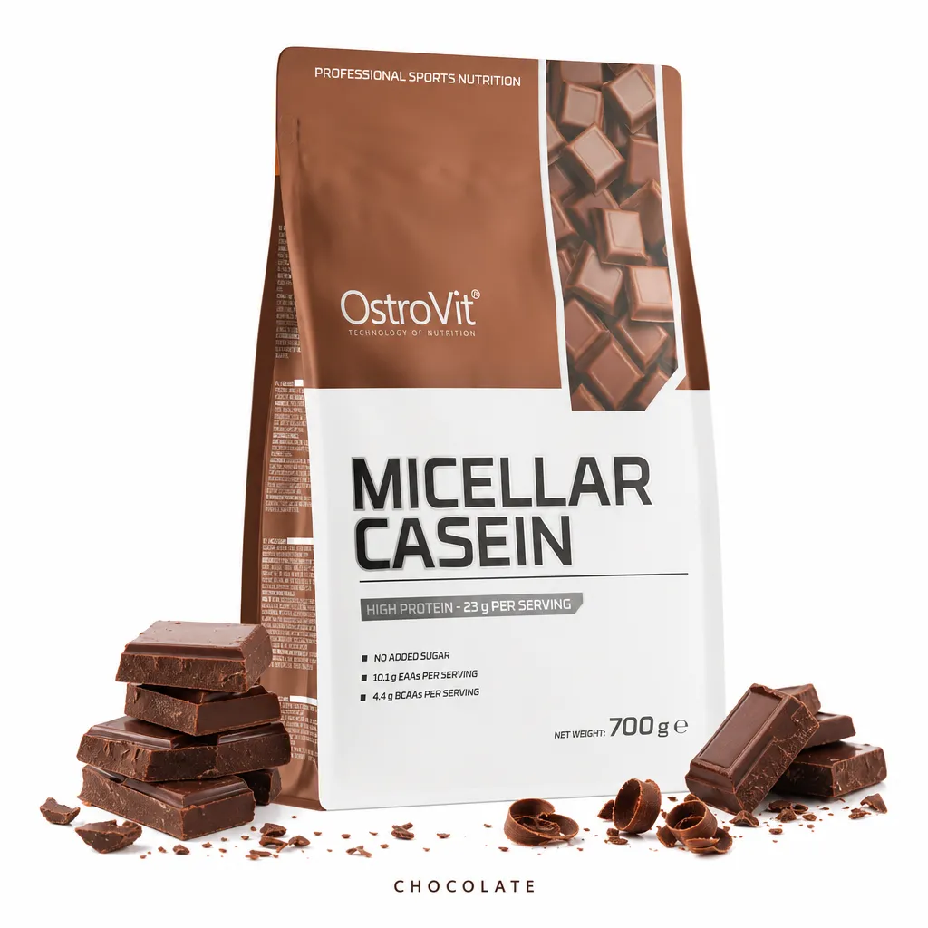 OstroVit Micellar Casein 700g chocolate protein powder, high protein, low sugar, slow-release formula for muscle recovery, shown in a resealable pouch with chocolate pieces.